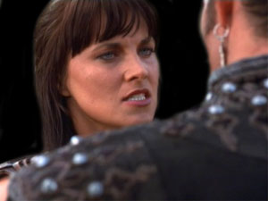 Xena looking at Ares agitated